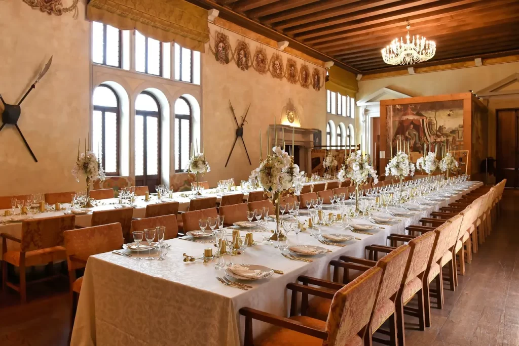 Elegant chapel decorated with white flowers for a destination wedding ceremony in Veneto, Italy