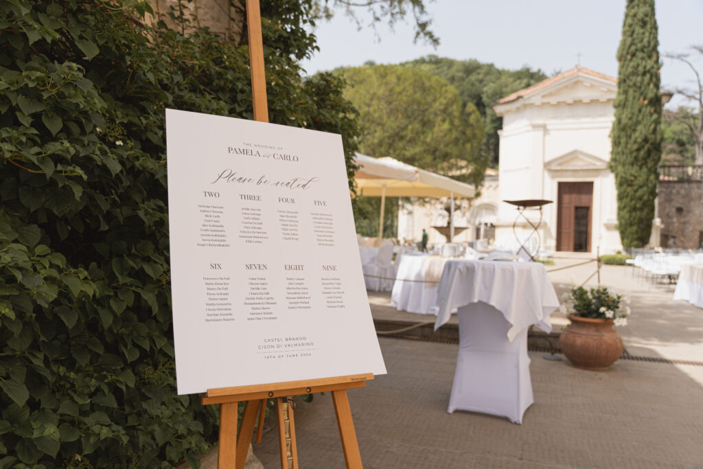 Sunset wedding reception setup on a panoramic castle terrace overlooking the Veneto countryside