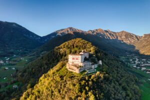 Aerial view of a majestic hilltop castle surrounded by the Veneto countryside in northern Italy