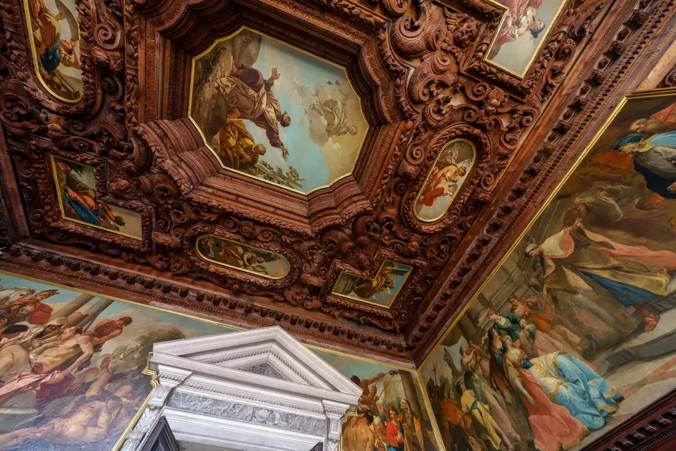 Detail of the carved wooden ceiling and paintings of the Archive Hall