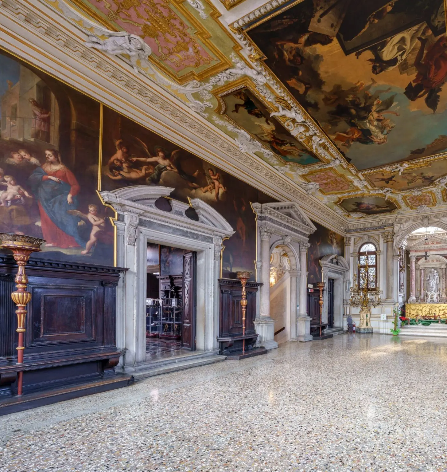 The Chapter Hall with its terrazzo floor, carved wooden panelling and ceiling paintings